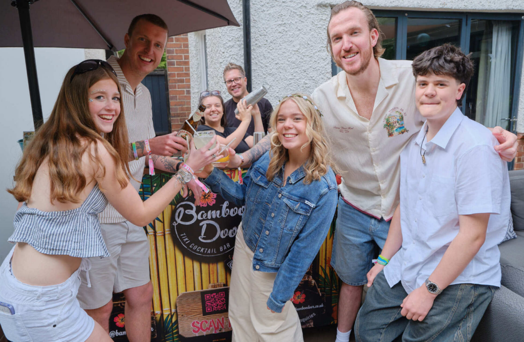 a photograph of a group waiting in line at the mobile bar at a party in sheffiled