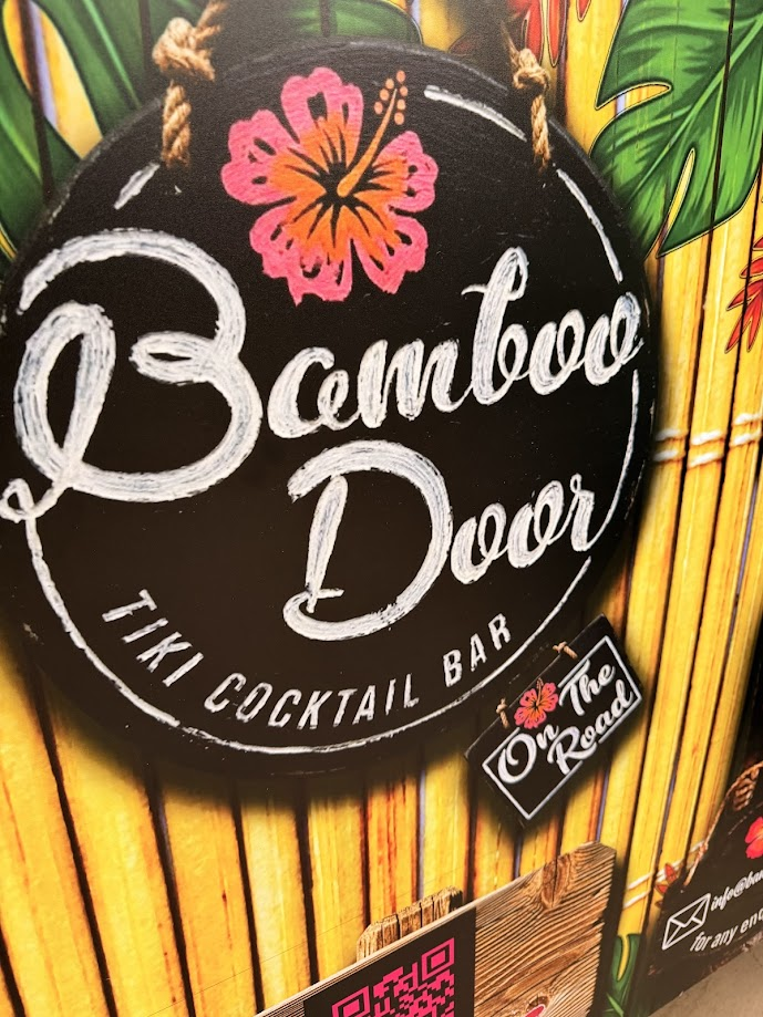 Bamboo Door on the road logo on a tiki themed mobile bar front